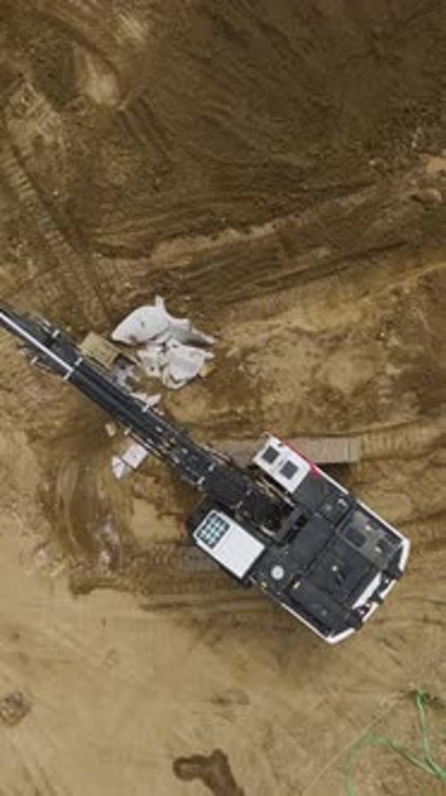 Aerial Shot of Concrete Breaker in Urban Setting