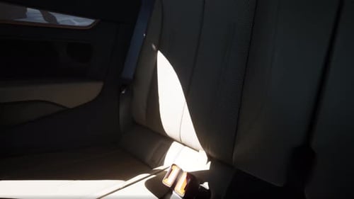 Moving Sunlight in Modern Car Backseat Interior