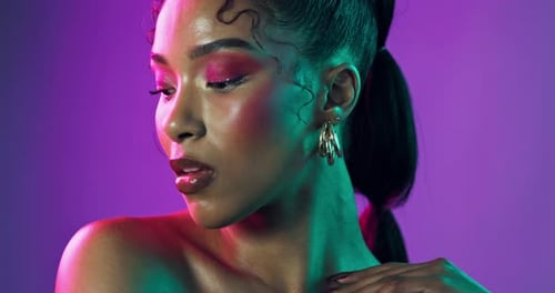 Woman, face and neon in studio for beauty, makeup and cosmetics with cyberpunk aesthetic