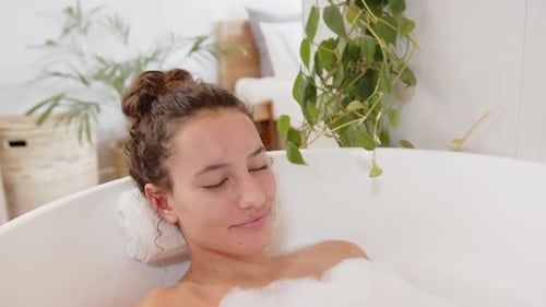Woman Relaxing in a Bubble Bath