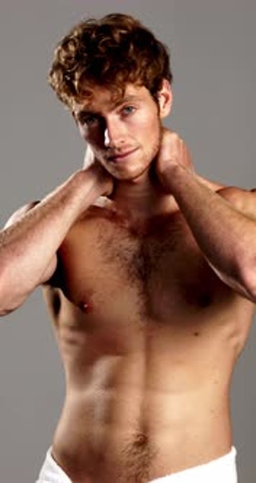 Confident, skincare and face of man with towel in studio for wellness, cleaning or hygiene routine