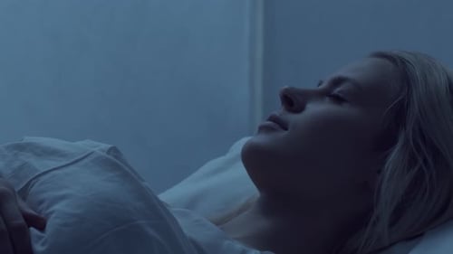 Woman sleeping peacefully in bed at night