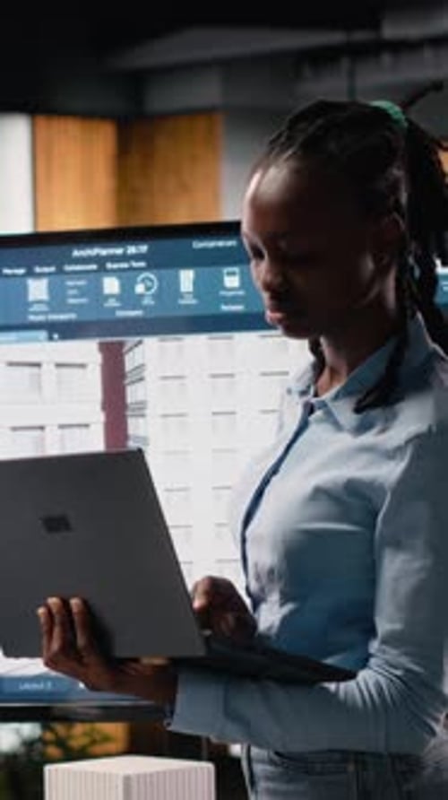 Vertical Video Black Female Developer Reviewing Zoning Regulations with 3D Models