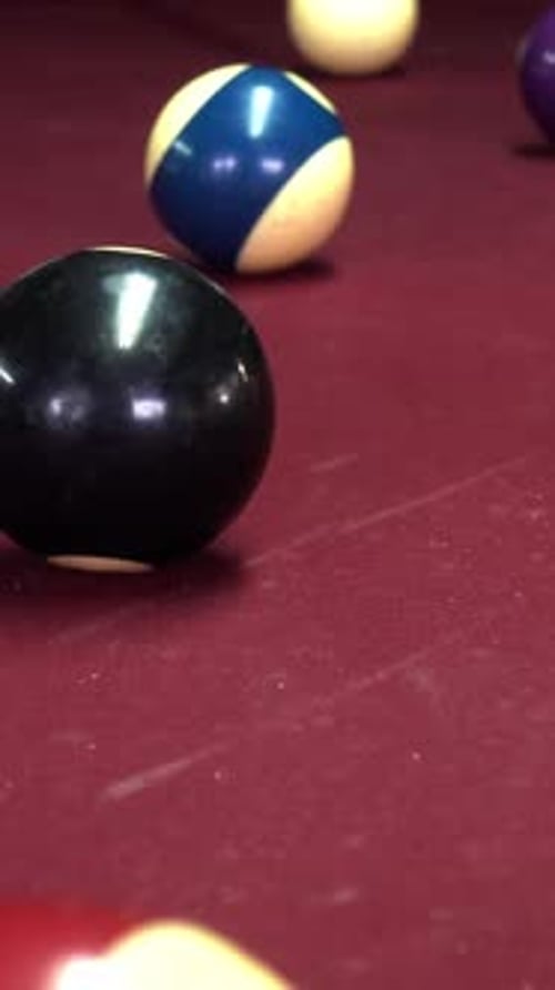 Vertical Video of billiard balls on a table