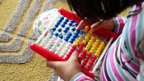Toddler Playing with Counting Math Learning Toy