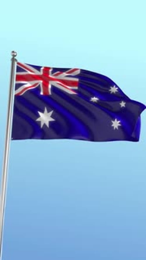 Australian Flag Waving Against Clear Blue Sky Vertical Loop