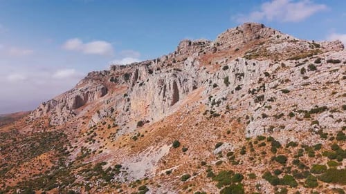 Wide view of rocky hillside and dry countryside