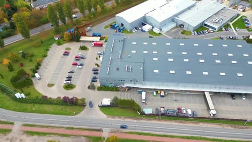 Aerial Drone Footage of Busy Industrial Warehouse and Logistics Hub