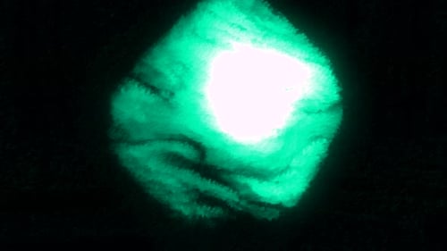 Black background. Motion. Turquoise and purple volumetric ball