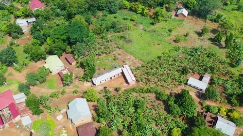 Aerial drone shot of a countryside house on a farm in Uganda Africa.