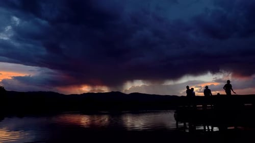 Dramatic sunset and storm clouds over the Coot Lake, Boulder, Colorado