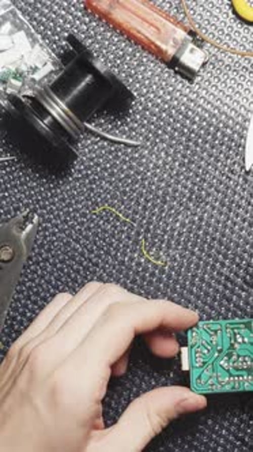 Soldering electronic boards, solder paste, tin close-up Vertical video.