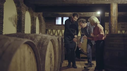People Tasting Wine in Winery Wine Cellar