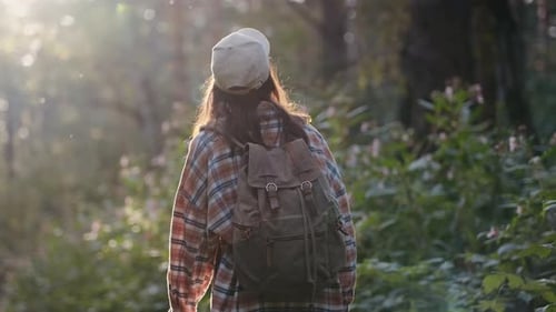A Girl Walks Through a Natural Forest The Woman is Traveling Alone Active Lifestyle People in the