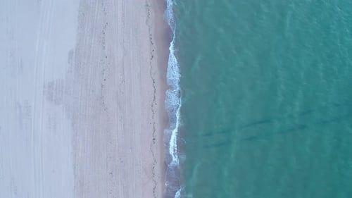 Aerial dolly forward shot of North Sea after sunset. Birds eye