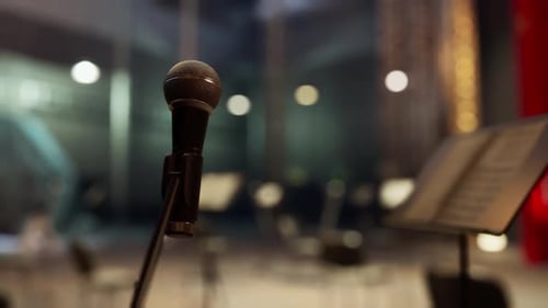 A Microphone That is Sitting in Front of a Music Stand