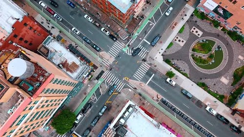 Cars ride by the crossroads in the district of New York, USA.