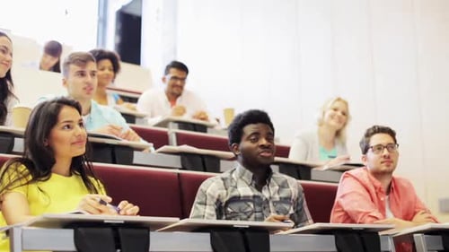 Students attending lecture in tiered seating classroom