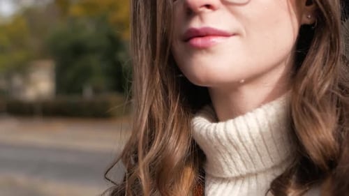 Young Beautiful Woman Walks Around the Autumn City Close Up Woman Portrait