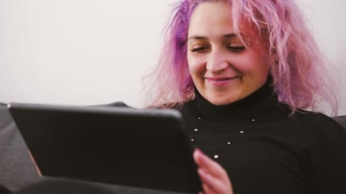 Young Woman Using Tablet at Home