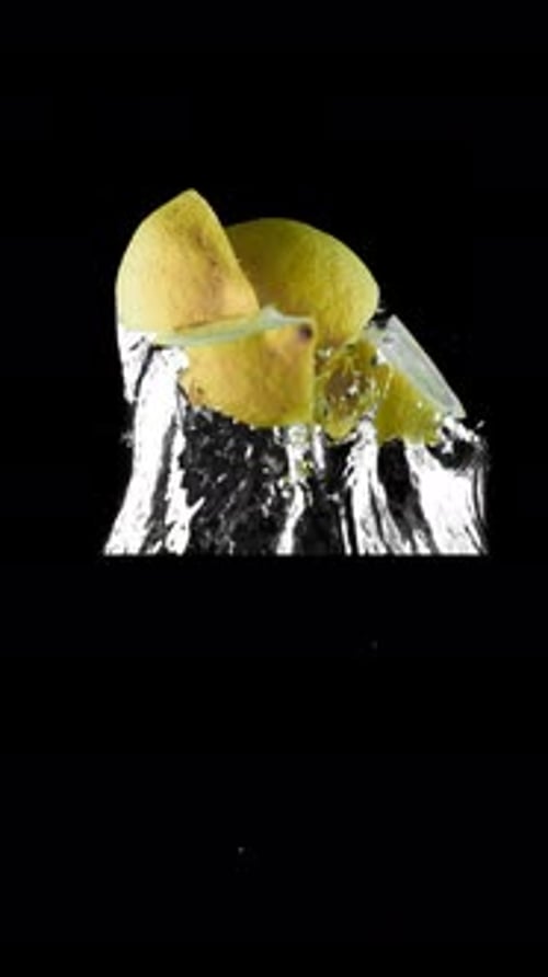 the Lemon Falls Very Slowly Into the Water