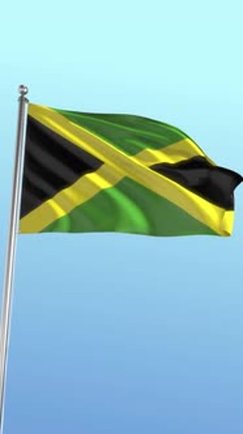 Realistic Waving Jamaican Flag on Pole Against Blue Sky