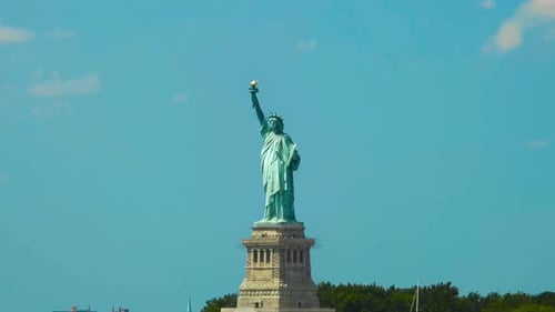Timelapse animation of The Statue of Liberty falling together during a sunny day in United States.
