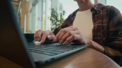 Unrecognizable Woman Typing on Laptop