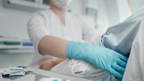 Hospital nurse taking blood sample for coronavirus test in modern laboratory