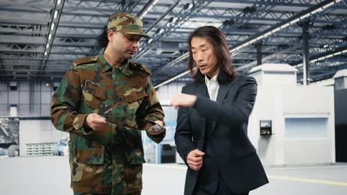 Microelectronics Factory Manager and Soldier Increase Production of Microchips