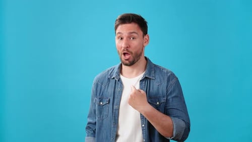 Man Shakes Head and Shows Palms in Refusal and Disapproval