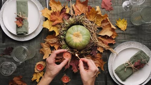 Festive Table Setting with Pumpkin and Fall Leaves