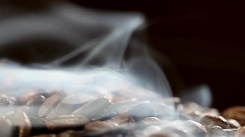 Coffee Beans Smoking in Close Up Footage