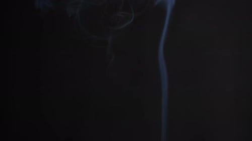 Rising Wisps of Soft White Smoke on Black