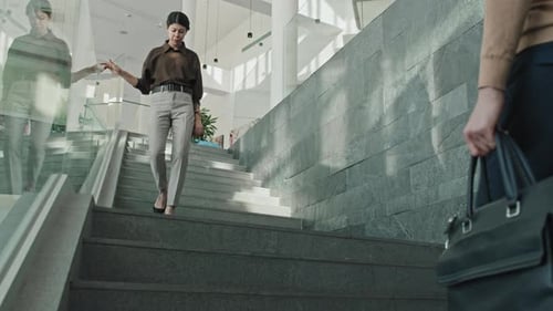 Office Workers Walking the Stairs in Office