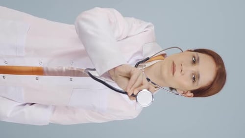 Woman Doctor Holds Stethoscope up to Camera
