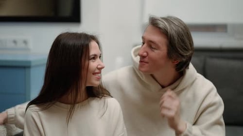 Smiling Couple Enjoying a Loving Moment at Home
