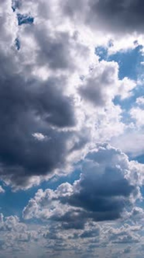 White Cumulus Clouds Moving Fast Across Bright Blue Sky Timelapse