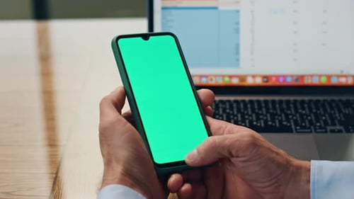 Manager Fingers Swiping Greenscreen Mobile at Office