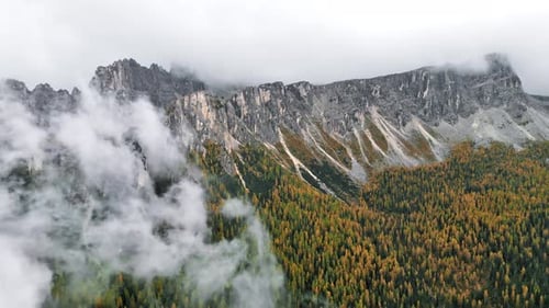 Aerial drone view of Seceda mountain range in autumn in Dolomites, Italy