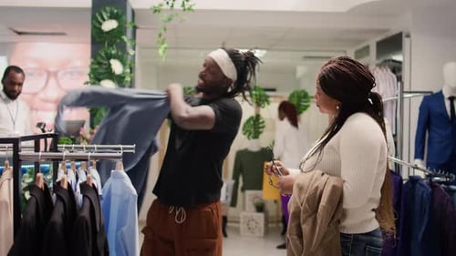 Customers Shop in Stylish Clothing Store