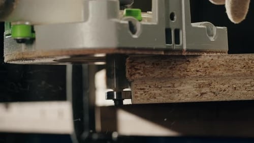Gray Router Cutting Wood with Clamp