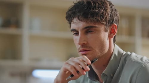 Portrait Attractive Serious Man Sitting Kitchen Pensive Freelancer Working Home