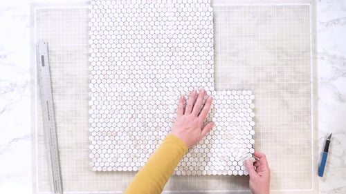 Arranging Honeycomb Tiles for DIY Project at Home