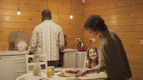 Happy Family Preparing Breakfast Together in Rustic Kitchen