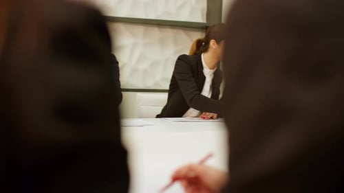 Business Meeting with Professionals in Modern Office