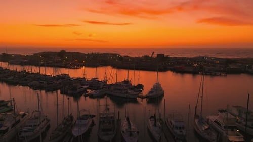 Fishing sailing boat jetty marina harbour at sunset at Moss Landing. Boats and landing stages aerial