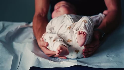 Infant Lying on Examination Table in Doctor's Office