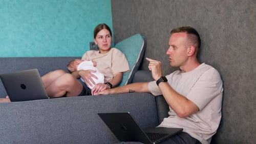 Family Working From Home With Young Child
