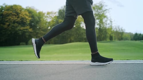 Energetic Afro Man Running in Park Slow Motion